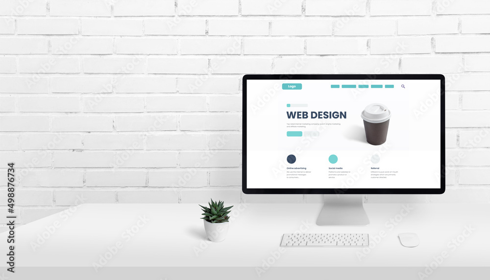 Fototapete Web design homepage concept on computer display with copy space beside