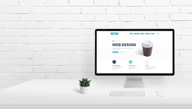Web design homepage concept on computer display with copy space beside