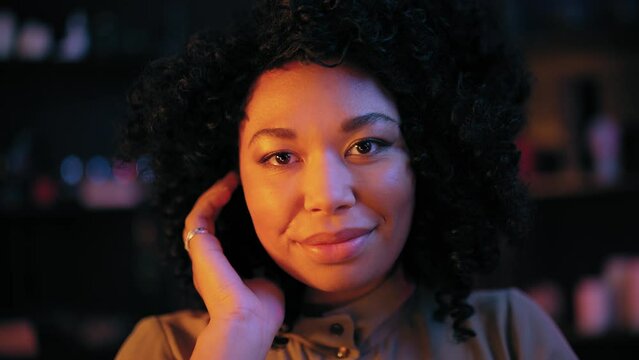 Woman with psychic powers smiling on camera, hypnotizing client, witchcraft