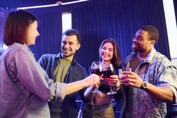 Weekend relax. Group of friends having fun in the night club together