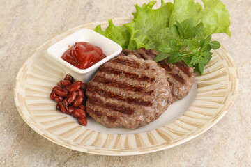 Grilled beef burger cutlet with sauce