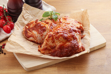 Marinated chicken leg in tomato sauce