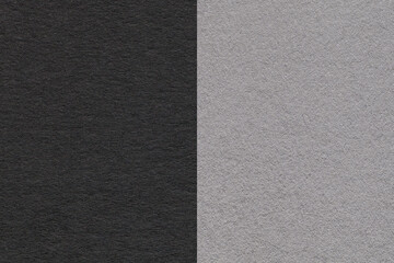 Texture of craft black and gray paper background, half two colors, macro. Structure of vintage grey...