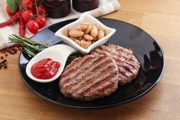 Grilled beef burger cutlet with sauce