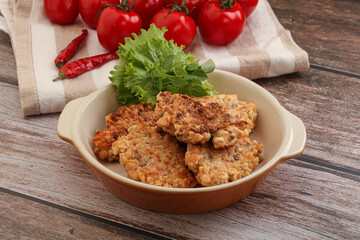 Fried salmonn cutlet in the bowl