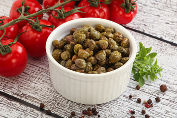 Marinated green capers in the bowl