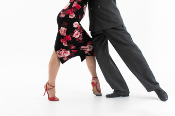 Feet of professional tango dancers in dancing movement