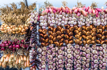 Onion, garlic and chili peppers in a market