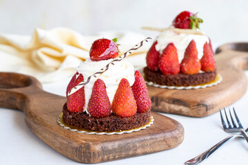 Strawberry cake. Cake filled with cream in the middle, surrounded by strawberries, on a white background. Bakery products. close up