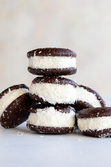 Chocolate biscuit with milk filling. Cake with milk filling on a white background. Chocolate-milk kids dessert. Bakery products. Close-up. local name sut dilimi