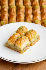 Pistachio baklava. Pistachio baklava in plate. Traditional middle eastern cuisine flavors. Close-up.