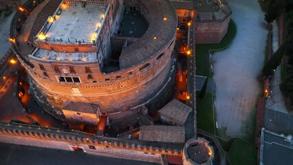 Castel Sant'Angelo and San Pietro in Rome at night, tourism in Italy, Rome aerial view in the evening , aerial view of the Tiber river, its bridges and St. Peter's, Vatican City.