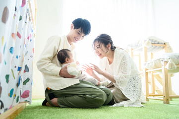 Family relaxing in children's room Backlit