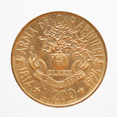 Italy - circa 1994: a 200 lire coin of Italy showing the symbol of the 180 years of the Carabinieri...