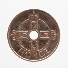 Norway - circa 2009: one crown coin of Norway showing an emblem and monogram of the crown of King Harald V in the shape of a cross. Crossed hammers