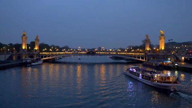 Paris, France. 03-30-2022. Alexander III bridge illuminated at night. City of paris. Slow motion 4K