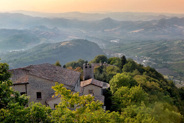 old house on a hill in and mountain landscape background in san marino- italy