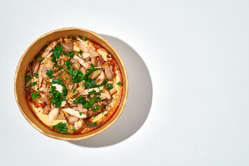 Hummus with chicken kebab in a delivery box on an white background