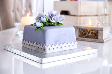 Beautiful decorated fruit cake with blue roses