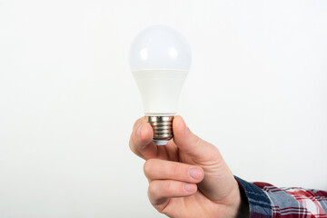 man holding a light bulb in his hand