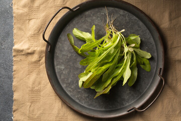 Bunch of green salad on a metal tray