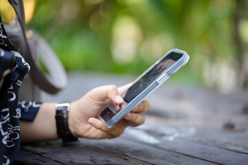 Close up woman's use of smartphone.

