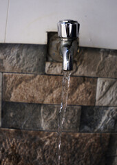 Water Flowing From a Tap