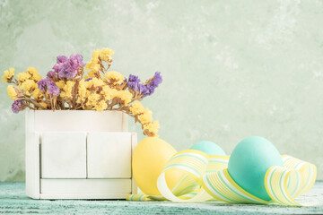 blank calendar for easter on table decorated with colorful eggs