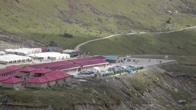 Kedarnath surroundings, Uttarakhand, India Helicopters carrying pilgrims, meadows near Kedarnath, cottages for pilgrims to rest
