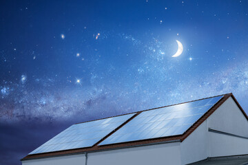 Roof covered with solar panels at night