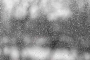Dirty window pane covered with dried raindrops.