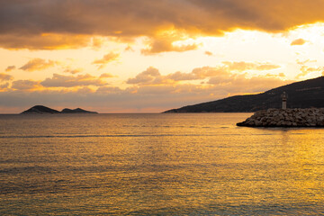 Fototapeta na wymiar Breathtaking colorful orange sunset at Mediterranean sea, reflecting in water.Beautiful seaside,coastline.Copy space.Beauty in nature concept