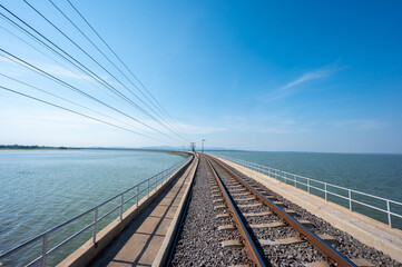 Area of Railroad tracks with floating railway bridge over water reservoir at Pa Sak Cholasit Dam,...