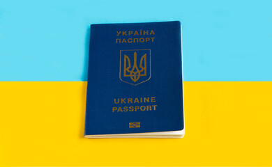 passport of Ukraine on the yellow-blue flag of Ukraine. International passport . National Emblem of Ukraine for passport. High quality photo