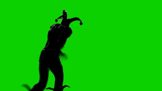 The Nightmare Jester dances. The clown dances a spooky dance. Atmosphere of fear and horror. Nightmare Jester Concept. Green screen animation perfect for scary and apocalyptic backgrounds