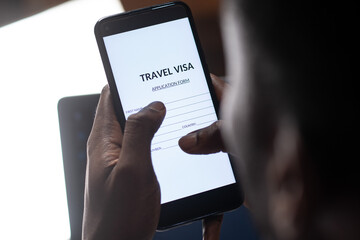 black person filling travel visa application on a phone