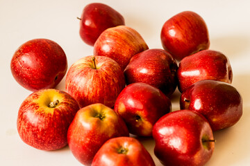 Fototapeta na wymiar Lots of red apples on the ground