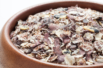 Multigrain made from rye, triticale, black rice, black beans, black sesame in a wooden bowl.