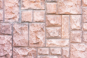 Red brick wall. Horizontal decorative uneven blocks background. Urban architecture texture. Solid stone texture. Grunge brickwork structure.