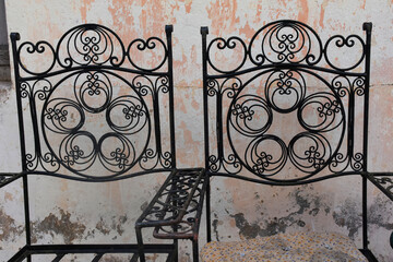 The antique wrought iron chair