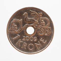 Norway - circa 2009: one krone coin of Norway showing a bird on an artistically designed branch