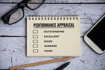 Performance appraisal checklist on notepad with with office setting background. Performance review concept
