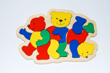 Wooden toy for baby, children isolated on white background. Mosaic with bears.