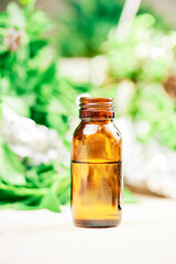 bottle of fragrant essential oil, for massage and natural therapies.