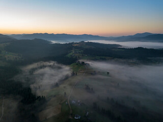 Morning fog in the Ukrainian Carpathians. Aerial drone view.