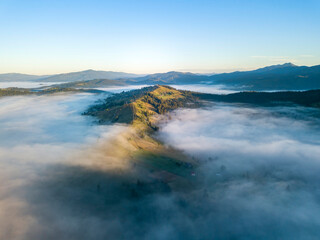 Morning fog in the Ukrainian Carpathians. Aerial drone view.