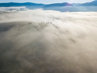 Morning fog in the Ukrainian Carpathians. Aerial drone view.