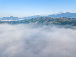 Morning fog in the Ukrainian Carpathians. Aerial drone view.