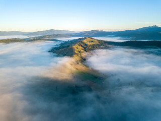 Morning fog in the Ukrainian Carpathians. Aerial drone view.