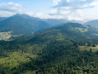 Green mountains of Ukrainian Carpathians in summer. Sunny day. Aerial drone view.